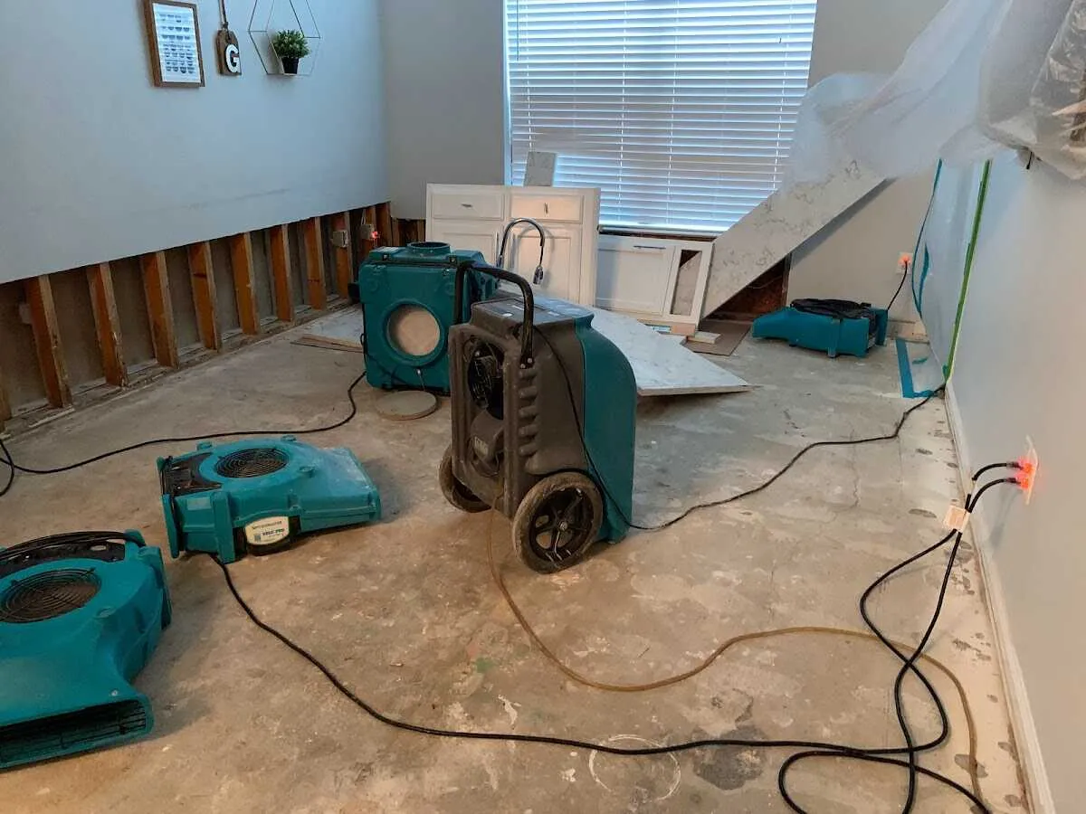 Dehumidifier in flood-cut room for Water Damage Restoration in Norwood
